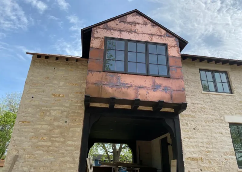 Copper metal panel facade on a stone building for Skylight Installation in Princeton